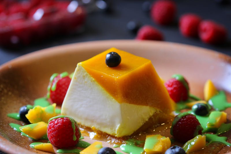 Panna Cotta dessert with berry sauce at Marcos